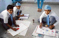 Students participate in the poster and slogan-making competition held at Sri Guru Harkrishan Public School in Doraha to celebrate World Health Day on Saturday.