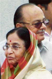 President Pratibha Patil, after she was greeted by Union HRD Minister Arjun Singh before her departure on a foreign visit, in Air Force Station in New Delhi