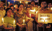 Panjab University Teachers Association and Panjab University campus students take out a candle light procession on PU campus on Sunday.