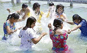 Pilgrims take a holy dip in Braham Sarovar on the occasion of Baisakhi in Kurukshetra on Sunday. 