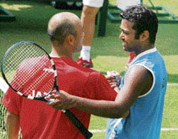 India's Leander Paes shakes hands with Japan's Satoshi Iwabuchi after their Asia/Oceania Zone Group-I Davis Cup second round reverse-singles match in New Delhi on Sunday. Iwabuchi beat Paes 6-4, 4-6, 6-4. 