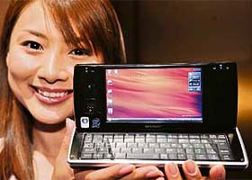 A model displays Japanese mobile phone operator Willcom's smart phone "D4", equipped with Intel's Atm processor, in Tokyo