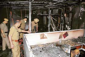 Fire officials inspect the office of a software company in Sector 34, Chandigarh