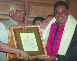 Lok Sabha speaker Somnath Chatterjee presents the best legislator award to NCP MLA Ramvir Singh Bidhuri on the birth anniversary of Baba Sahab Ambedkar at the Old Secretariat in the Capital on Monday. 