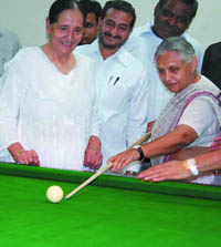 Chief Minister Sheila Dikshit enjoys a game of snooker during the inauguration of a multipurpose hall at Kaka Nagar in the Capital on Monday. 