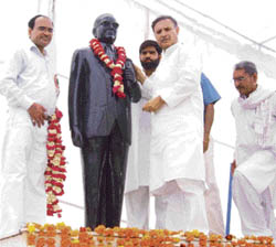 The union minister of state for defence production, Rao Inderjit Singh, garlands a statue of Dr B.R. Ambedkar at Bawal (Rewari) on Monday.