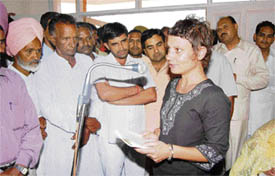 Debbie addresses villagers after Kunal Bhadoo laid the foundation stone of a community centre in Gilly Mundy Community School in Leherian village in Fatehabad on Monday.