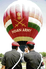Armymen trying to capture a shot of the hot ballooning show in their cell phone camera during the Jammu and Kashmir Light Infantry Diamond Jubilee function at the Paloura Stadium, on the outskirts of Jammu on Monday.