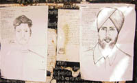 Sketches of the accused, who looted residents, displayed at police station, Ahmedgarh