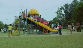 Children enjoy rides at a multiple play equipment in a Sector 22 park, Chandigarh, on Sunday.