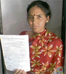 Kusum Giri shows the doctors prescription suggesting her to undergo an ESR test, the report of which is still awaited, in Chandigarh on Tuesday.
