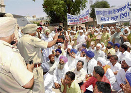 Relatives of Taranpreet Kaur protest in front of Sadar police station in Patiala on Tuesday. 