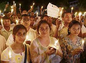 PGI technicians hold a candle-lit march in support of their demands in Chandigarh on Tuesday.