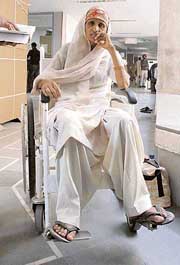 A patient from Kurukshetra waits for a test at the OPD block.