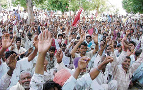 Hundreds of workers protest against inflation at Chatar Park in Ludhiana on Tuesday.