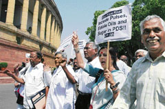Left and UNPA leaders stage a demonstration against price rise at Parliament House in New Delhi on Tuesday.