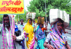 Representatives of street vendors from 25 different countries march from Ram Lila Ground to Parliament in the Capital on Wednesday.