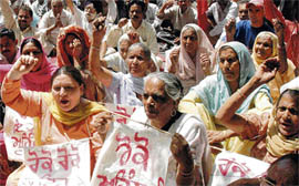 Members of Communist Party of India protest at Sector 17, Chandigarh, on Thursday.