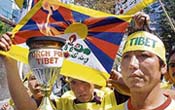 Members of the Tibetan Solidarity Committee hold a protest against the Olympic torch relay run in front of the high court and protesters carry the Torch for Tibet in Shimla on Thursday; and a dharna in progress@@in front of the district administrative complex in Dharamsala on Thursday.