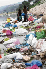 Despite tall claims made by the government, filth and garbage dumps float freely in the Tawi River.