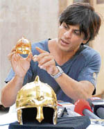 Owner of IPLs Kolkata Knight Riders Shahrukh Khan unveils an 18-carat gold-plated helmet and a diamond studded helmet in Mumbai