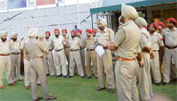 Policemen being briefed by officers at the PCA stadium in Mohali 