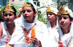 Schoolchildren participate in a rath yatra during the Mahvir Jayanti function organised by the Akhil Bhartiya Ahimsa Sangh in the Capital on Friday.