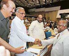 Haryana Chief Minister Bhupinder Singh Hooda shakes hands with Chief Justice of India K.G. Balakrishnan at a conference of Chief Ministers and Chief Justices of the high courts in New Delhi on Saturday.