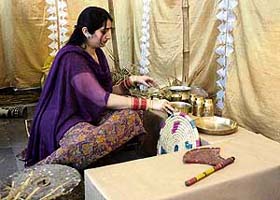 Students of the National Institute of Fashion Designing display their creation during the annual exhibition in Jammu