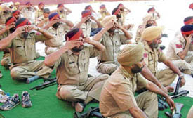 Policemen do yoga at a camp in Amritsar.