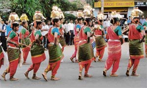 MUSICAL BONANZA: Folk dances by men and women are part of the vibrant procession