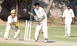Cricket match in progress between MCA and Sector 16 cricket teams at MCM College Sector 36, Chandigarh, on Sunday.