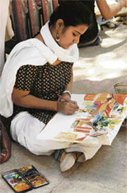 A participant during a painting competition held at Rock Garden in Chandigarh on Sunday.
