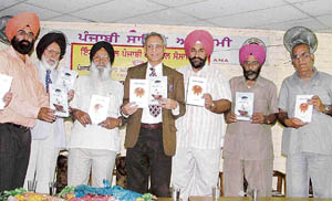 PAU vice-chancellor Dr M.S. Kang releases two books by Harbhajan Singh Dhillon at Punjabi Bhawan, Ludhiana, on Sunday. 