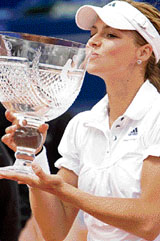 Russia's Maria Kirilenko kisses the trophy after winning the Estoril Open in Lisbon on Sunday.
