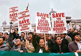 Demonstrators make their feelings known during a protest organised by the Ethnic Catering Alliance Association at Trafalgar Square, London