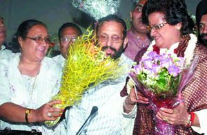 Congress corporator Razia Sultana along with BJPs Subhash Arya congratulates Aarti Mehra at Town Hall in the Capital on Monday.