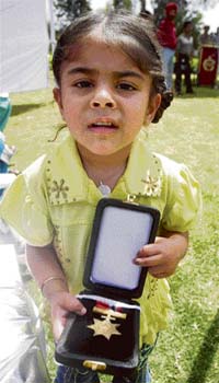Arzoo Sharma, daughter of late constable Rajesh Kumar, who was awarded Sher-i-Kashmir police medal posthumously