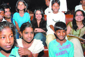 Actress Mahima Choudhury and director Tanuja Chandra with former child labourers and schoolchildren, who participated in a march, at an interaction at the FCCI Auditorium in the Capital on Wednesday.
