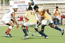 A match between SAI Lucknow and Namdharis XII in progress during the 6th All-India Jagtar Memorial Hockey Tournament (u-19) at Punjab Agricultural University in Ludhiana on Wednesday.