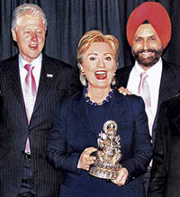 Hillary Clintion (centre) was given the idol of Lord Ganesha by Sant Singh Chatwal (right), chairman of the Hillary Clinton for President Exploratory Committee, after her winning the Pennsylvania Democratic primary in Philadelphia on Tuesday. Former US President Bill Clinton is also seen in the picture.