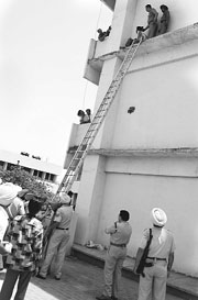 Joginder atop a five-storey building at the District Courts Complex in Patiala on Thursday.