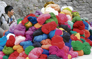 A roadside vendor sells colourful wool near the IGMC road in Shimla on Thursday. 