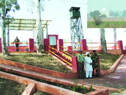 The viewing area on the border in Dera Baba Nanak to catch a glimpse of Kartarpur Sahib gurdwara in Pakistan. (Inset) Kartarpur Sahib gurdwara photographed from the viewing area.