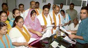 Sub-divisional magistrate Virender Dahiya administers oath to newly elected municipal councillors in Panchkula on Friday. 