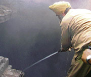 A fire brigade personnel tries to control a fire in the basement of a commercial complex in Ludhiana on Friday.
