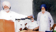 An alumni, Dalip Singh (right), being honoured at an old students meeting of erstwhile Khalsa School at Government Senior Secondary School at Kila Raipur village.