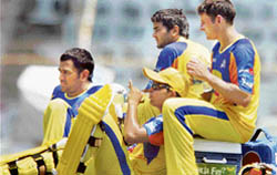 Chennai Super Kings captain M. S. Dhoni, Parthiv Patel, Suresh Raina and Michael Hussey rest during a practice session at the MAC Stadium in Chennai