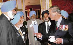 Britains Prince Charles (right) meets surviving veterans of the Sikh Brigade of the British Army at an event to mark the Sikh religious and cultural festival of Baisakhi at St James Palace, London, on Thursday