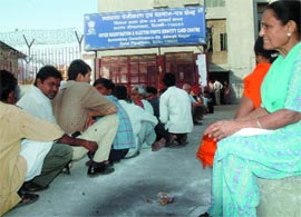 Residents wait in front of a voter registration & election photo identity card centre at Sarai Peepalthala in the Capital on Saturday.